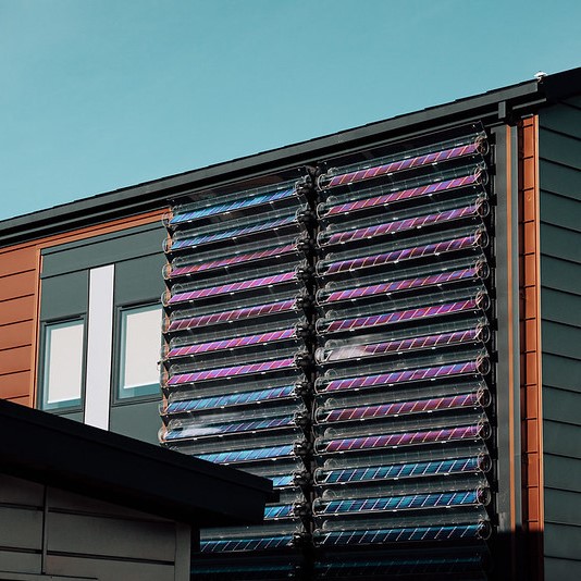 Naked Energy photovoltaic thermal tubes on the side of the Active Office.